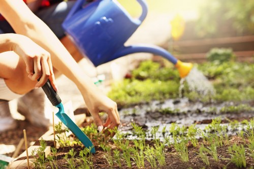 Operator preparing lawn mower for safe use in garden